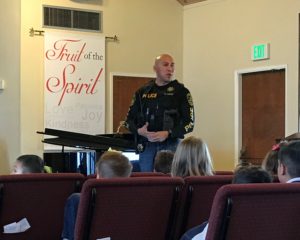 Police officer speaking to students at Calvary Christian School