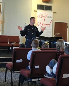 Police officer speaking to Calvary Christian School students