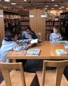 Calvary Christian School students reading in the library