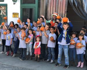 Calvary Christian School students holding pumpkins