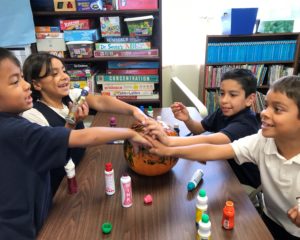 Children decorating at pumpkin at Calvary Christian School