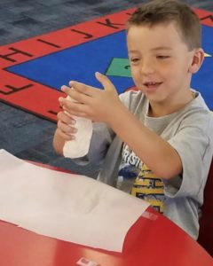 Young boy doing a craft at Calvary Christian School