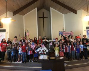 Calvary Christian School students with American flags